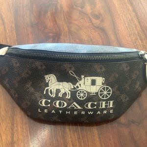 Authentic Coach horse and carriage cross body bag.